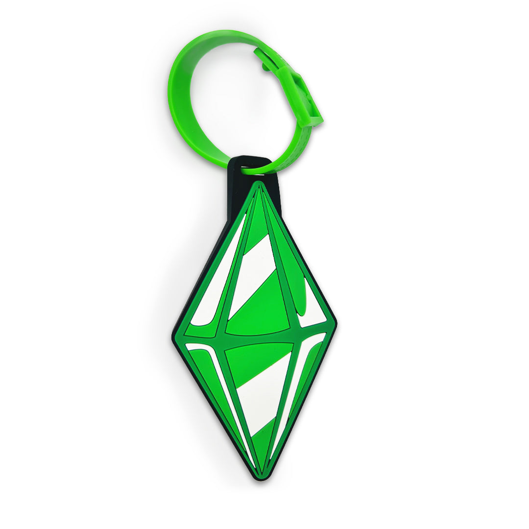 Green and black geometric keychain on a white background