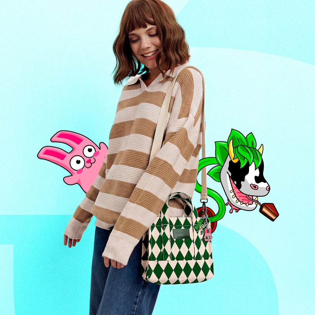 Woman wearing a striped sweater with cartoon characters on a blue background