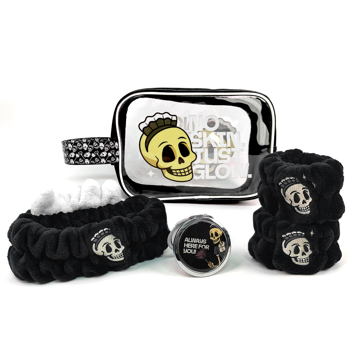 A hair accessory set featuring two black scrunchies with white skull prints, a black beaded headband, a clear zippered pouch with a yellow skull graphic, and a small round tin labeled 'ALLIUMS REFUSE FOR UOU'.