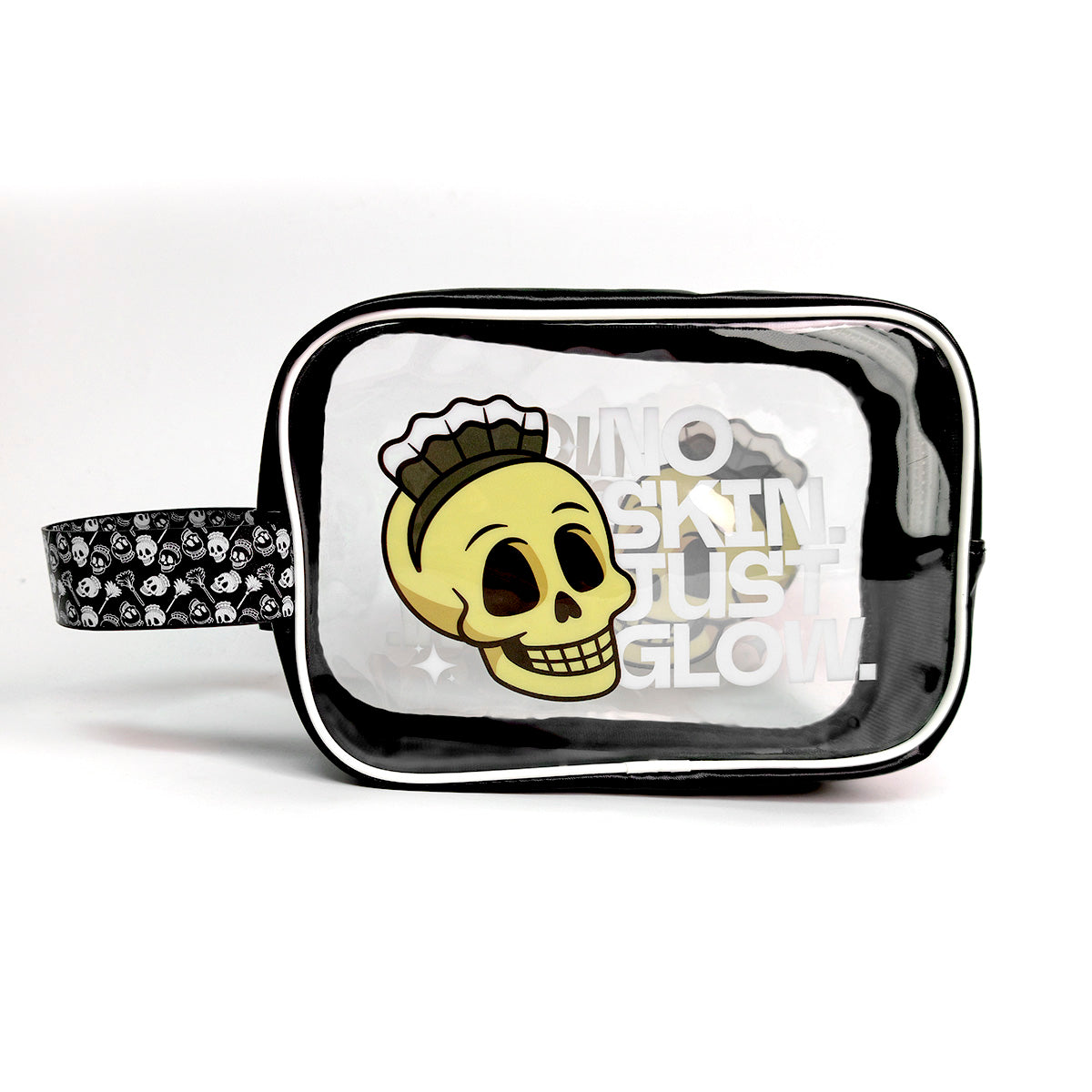 A clear vinyl cosmetic pouch with a black trim and handle, featuring a yellow skull graphic with a mohawk and the text 'NO SKIN JUST GLOW.' on a white background.