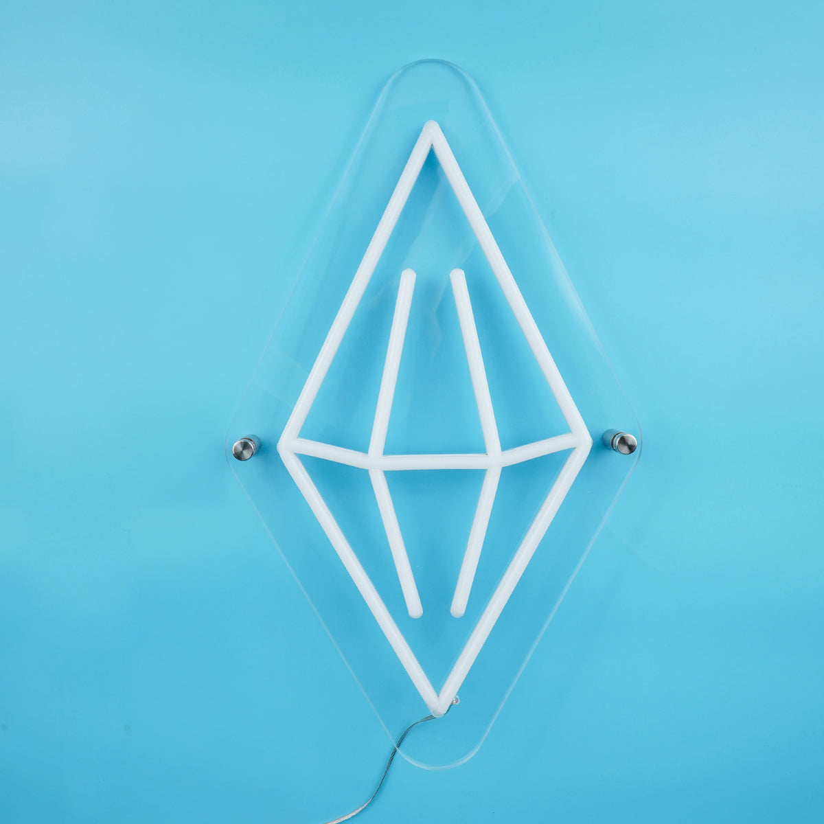 Geometric white light fixture on a blue background