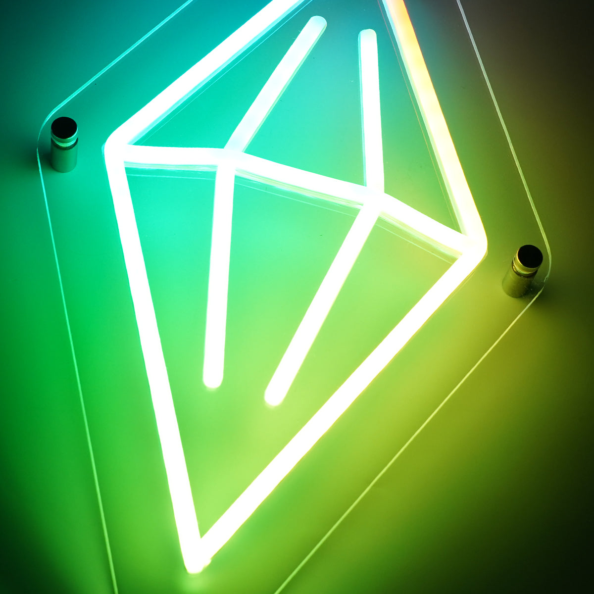 Neon geometric light fixture on a gradient green background